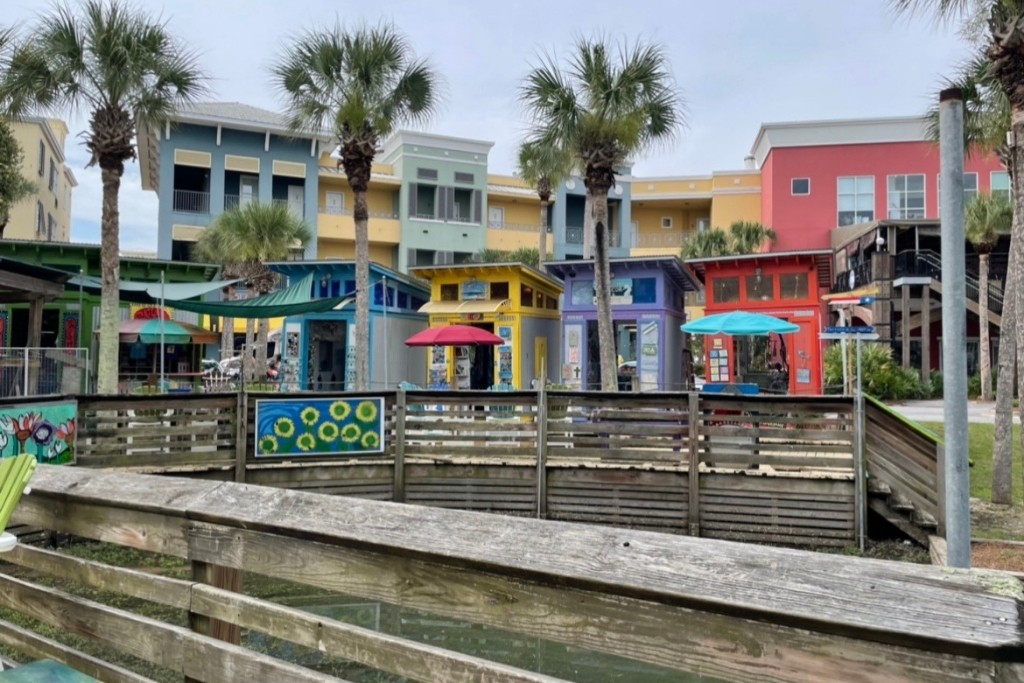 Gulf Place is a colorful area with restaurants, shops, art galleries, and the beach!