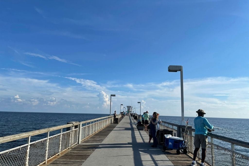 Walk the pier at The Boardwalk, it's also a great spot to go fishing in Okaloosa Island