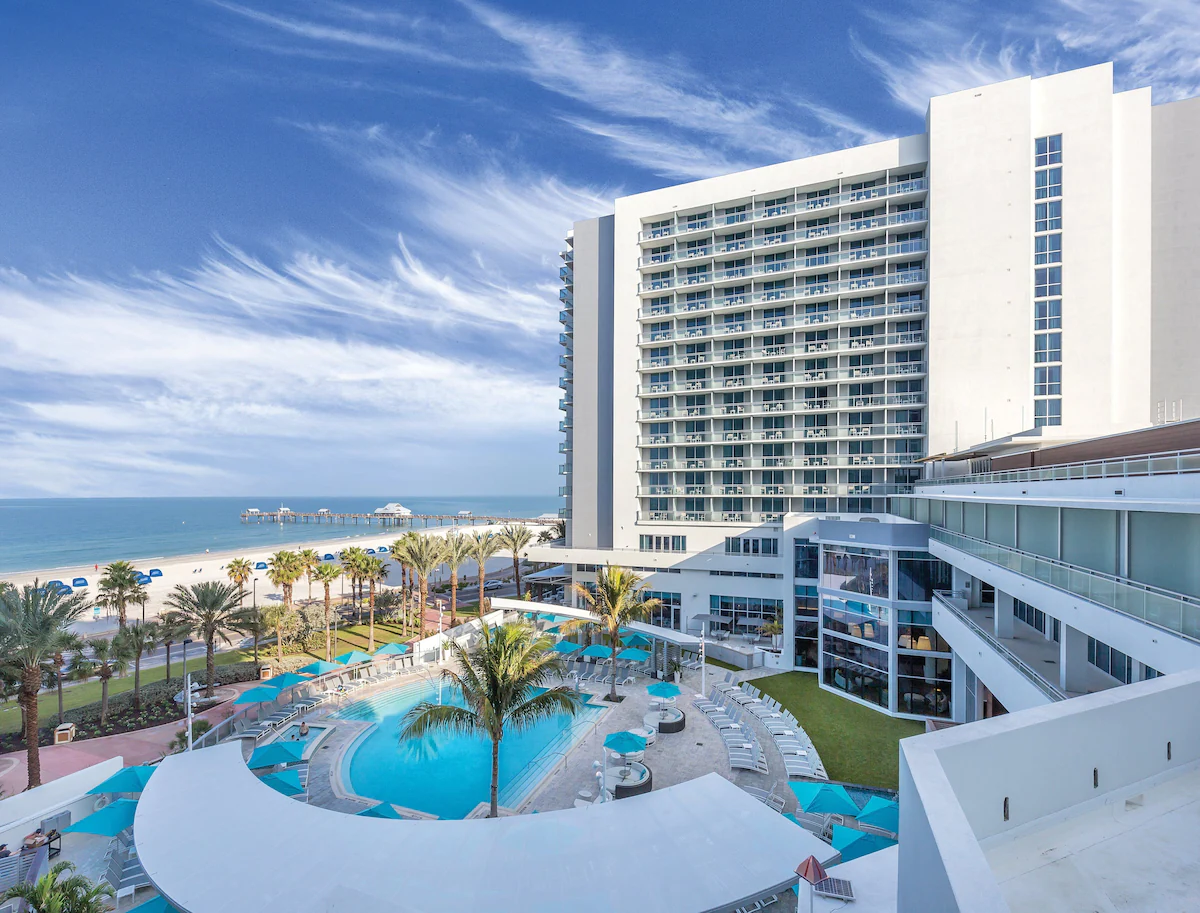 Exterior view of the Club Wyndham Clearwater Beach Resort with the overlooking view of the beach and a big outdoor pool.