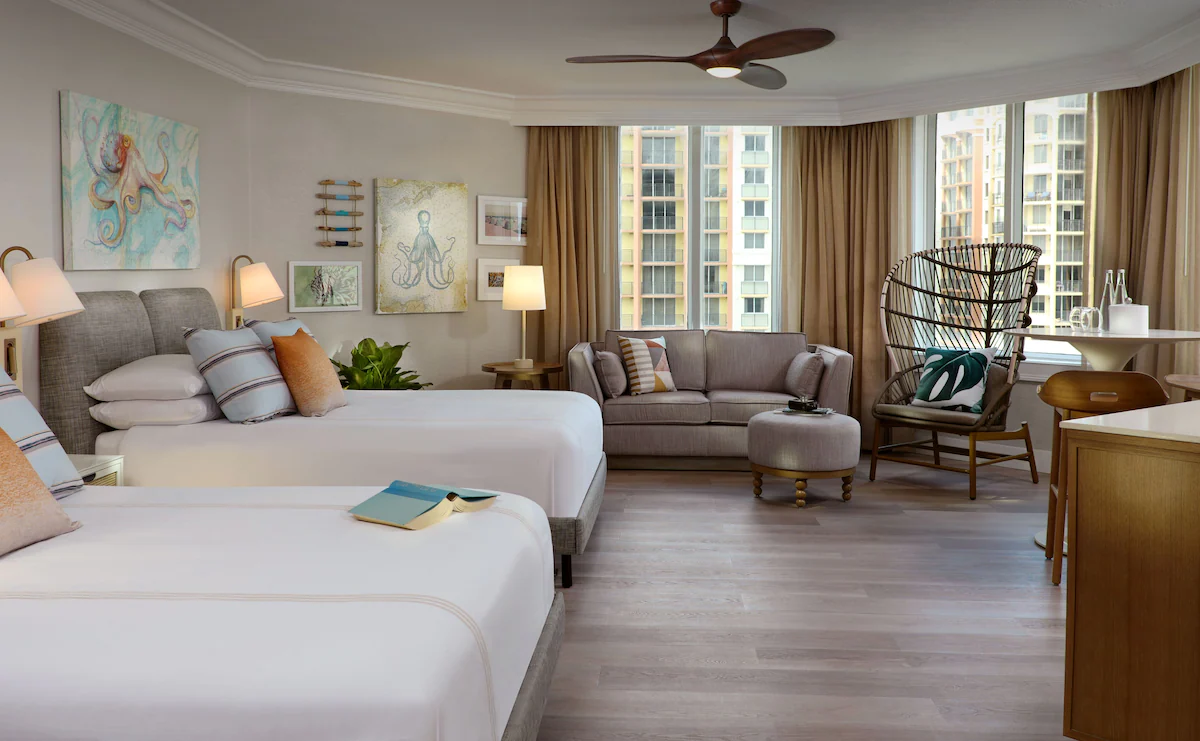 Bedroom interiors of Pelican Grand Beach Resort with 2 single beds