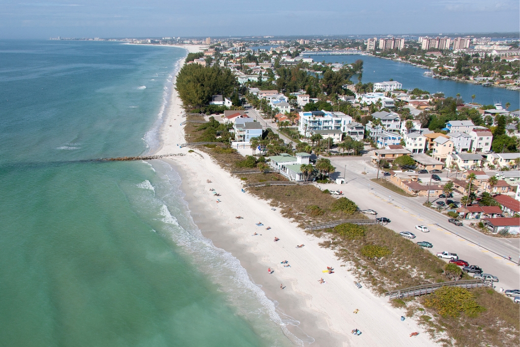 Aerial view of sunset beach with the houses and buildings in Florida