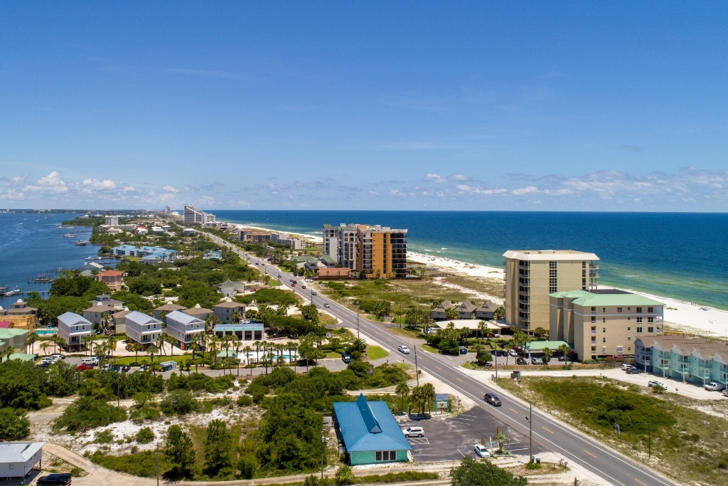 aerial view of the city houses, road, and buildings in Perdido Key Florida