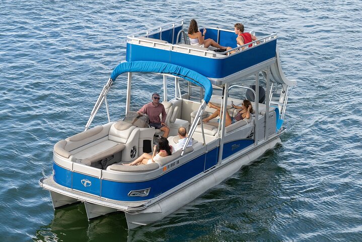 group of people in a double deck boat in a private Clearwater boat tour