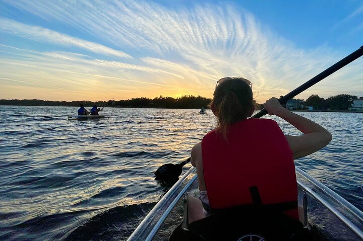 a woman's back on a kayak in Tarpon Springs water in Florida