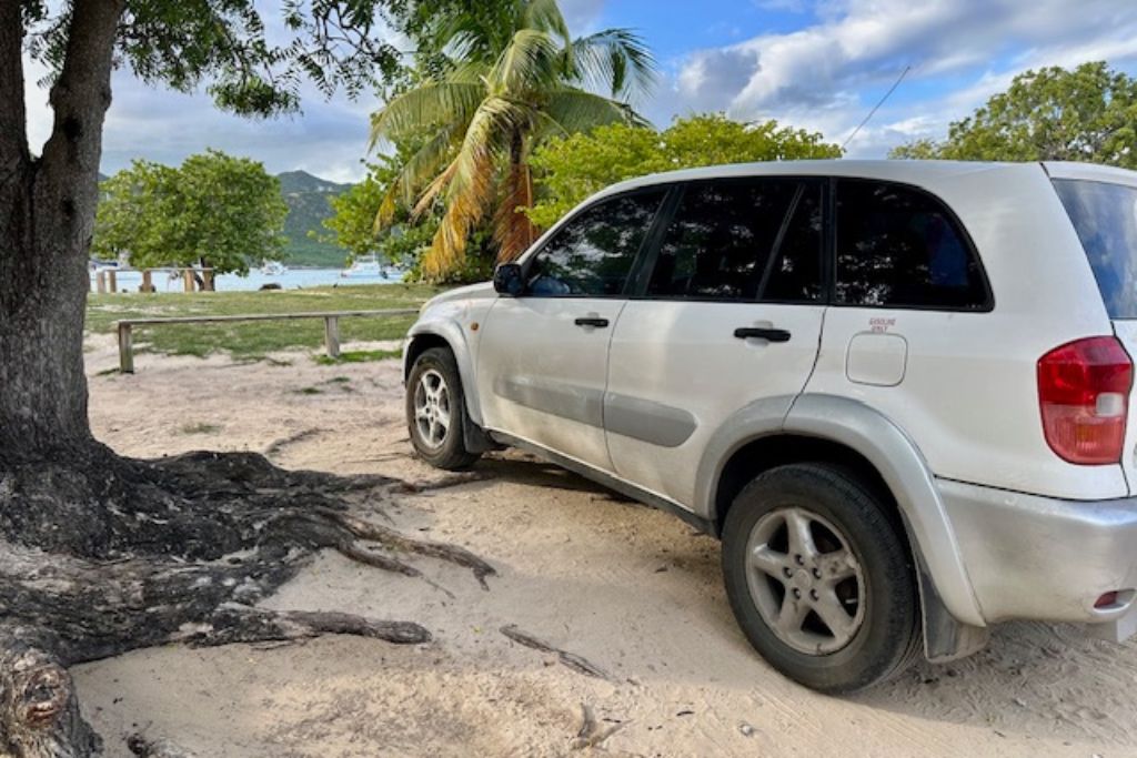 Sara's car parked in the beach in Antigua