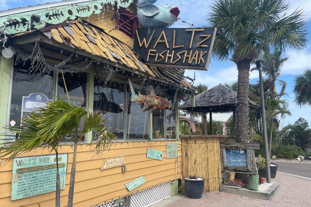 Tucked just off the main boardwalk, Waltz Fish Shak is a hidden gem in John’s Pass known for serving some of the freshest seafood around