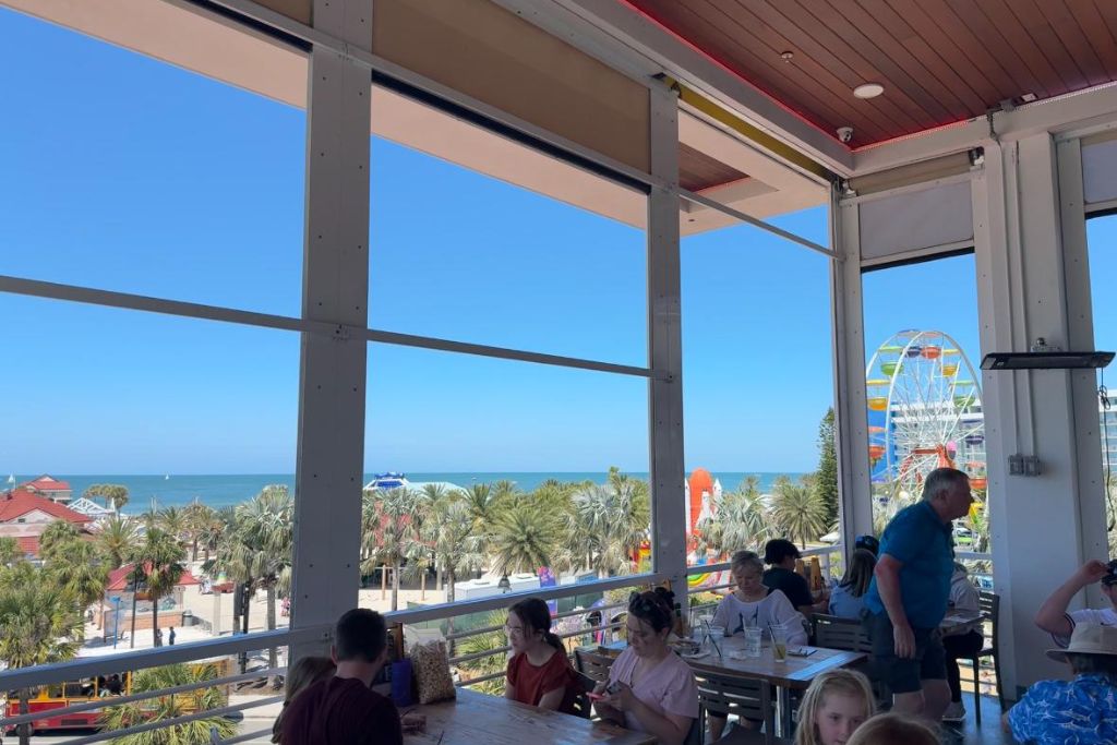 Visitors dining at Crabby's Restaurant, which is just a short walk from the beach