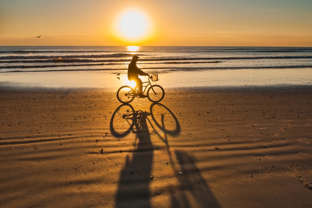 man biking during the sunset at Cocoa Beach Florida