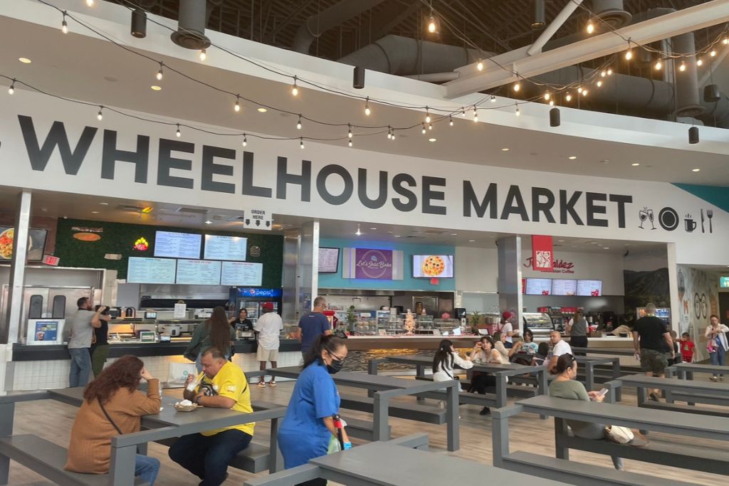people dining at the Wheelhouse Market in ICON Park Orlando