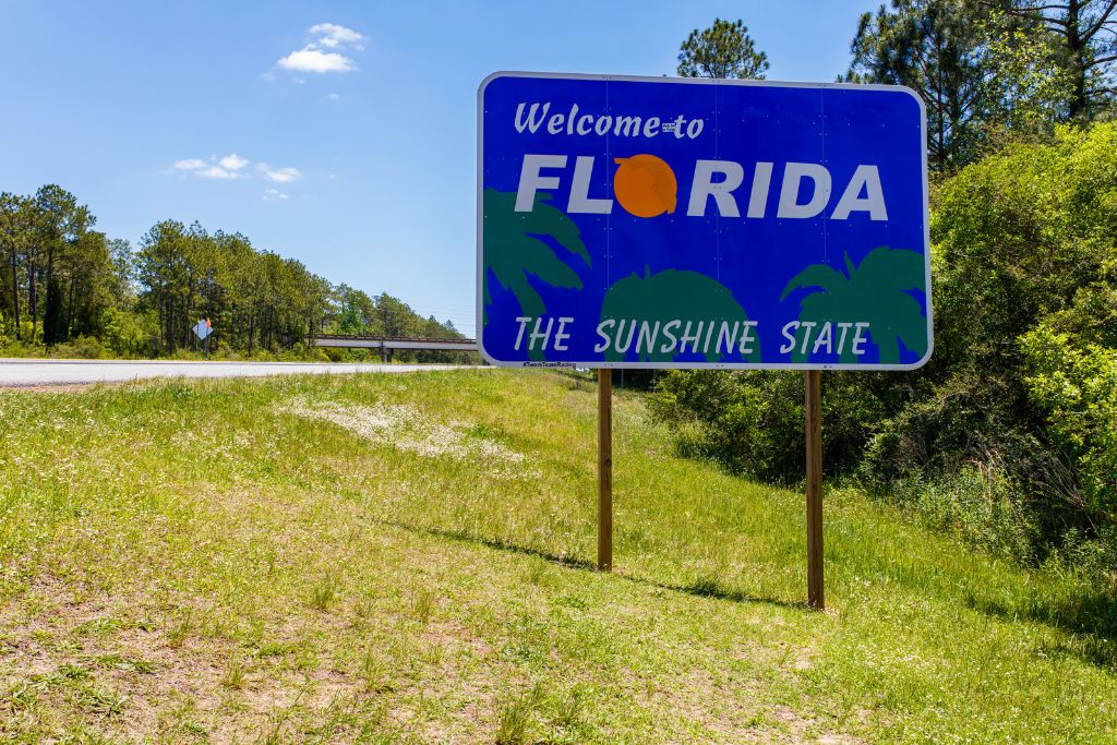 Looking on at the Welcome to Florida sign